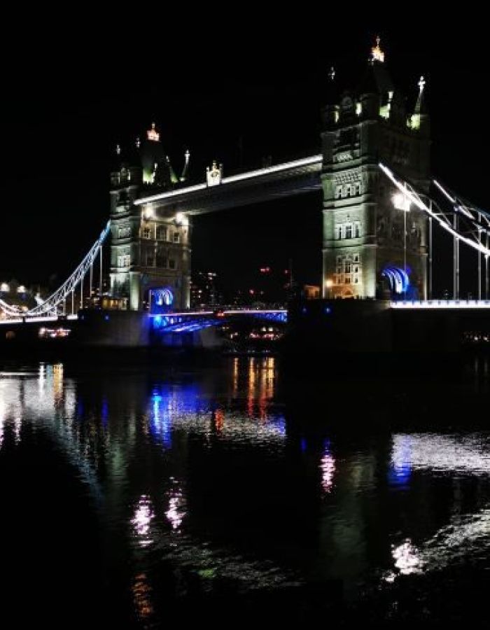 Tower Bridge lit up at night, next to Tower Bridge Quay where the Silver Bonito New Year's Eve cruise boards