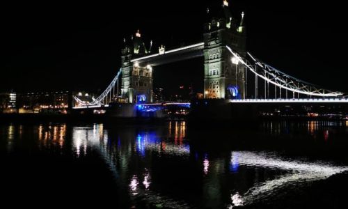 Tower Bridge lit up at night, next to Tower Bridge Quay where the Silver Bonito New Year's Eve cruise boards