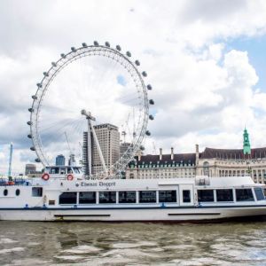 The Thomas Doggett river boat on the Thames in front of the London Eye