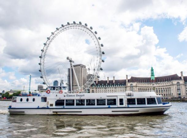 The Thomas Doggett river boat on the Thames in front of the London Eye