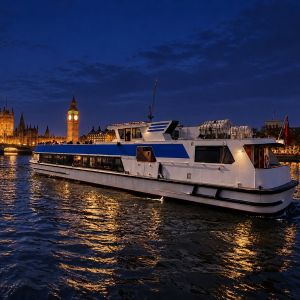 Thames cruise boat at night in front of the lit-up Big Ben and Houses of Parliament